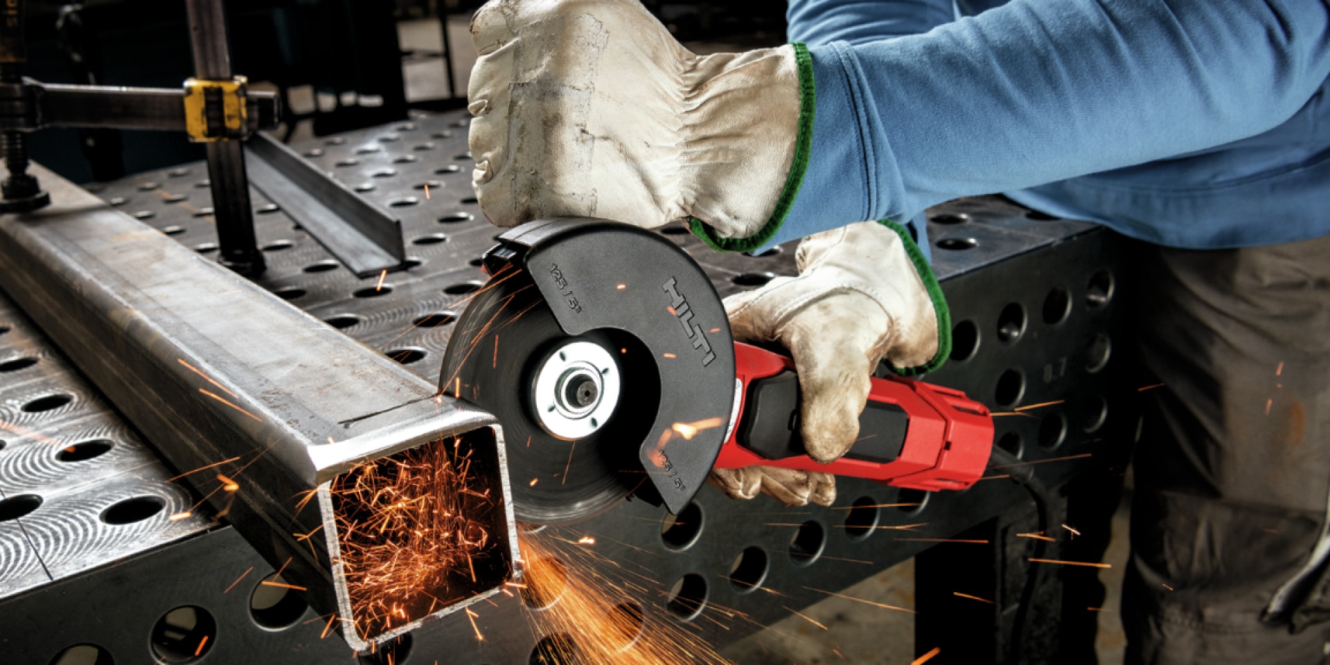 person using angle grinder