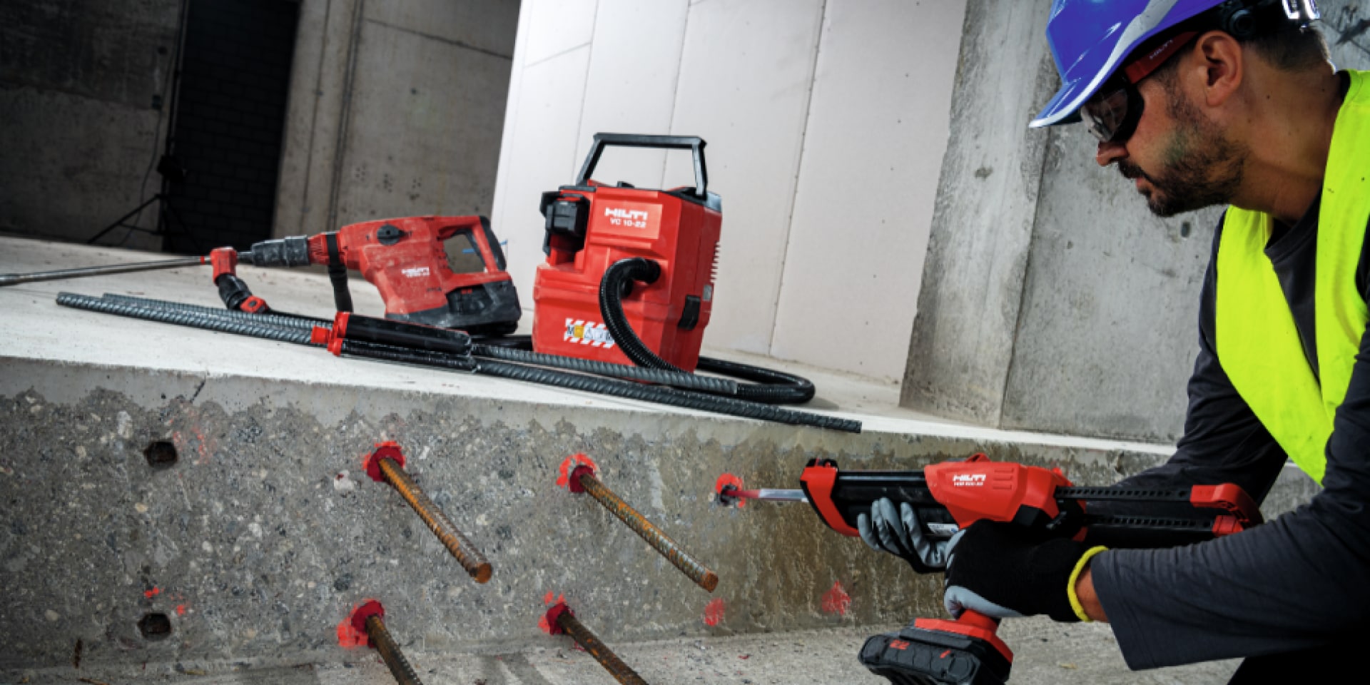 workman injecting concrete with dispenser 