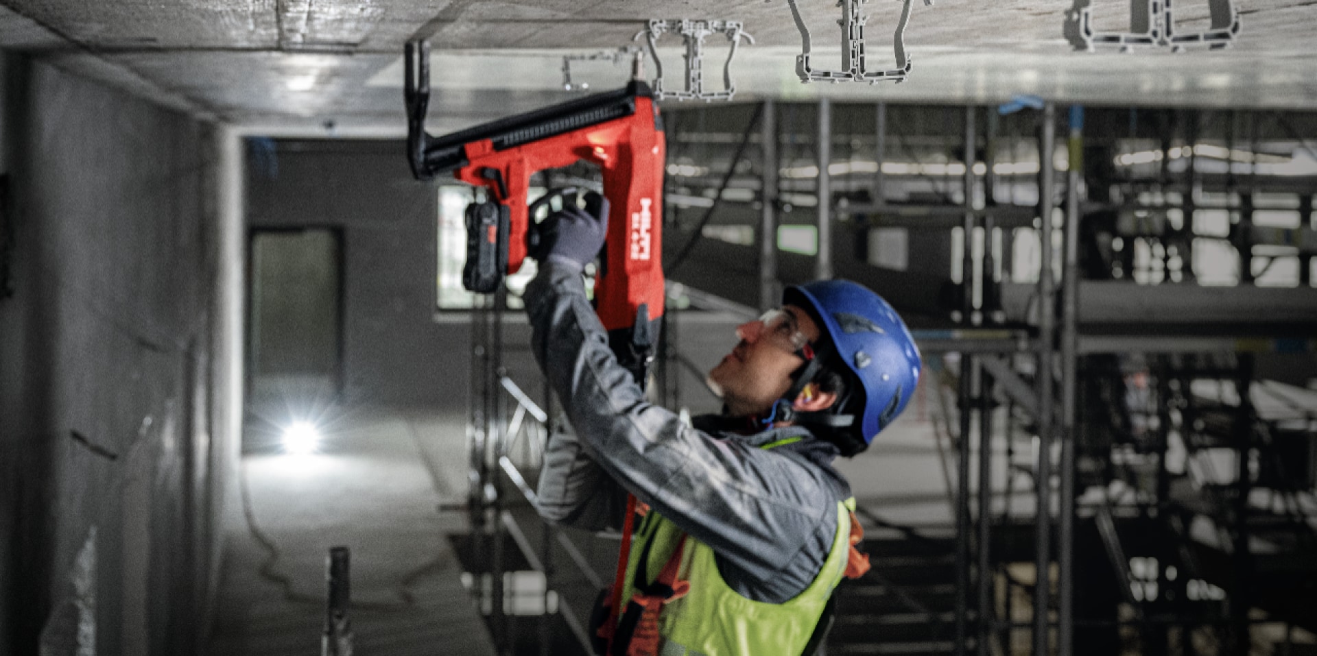 man holding a hilti nail gun